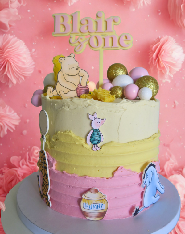 Winnie the Pooh 1st birthday themed cake